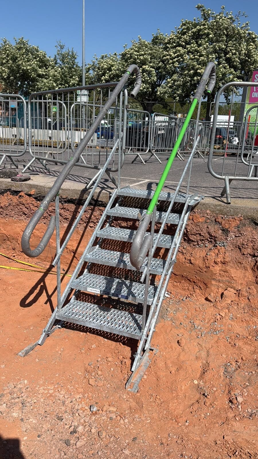 Safe access steps down into the excavation with the earthing conductor already run in
