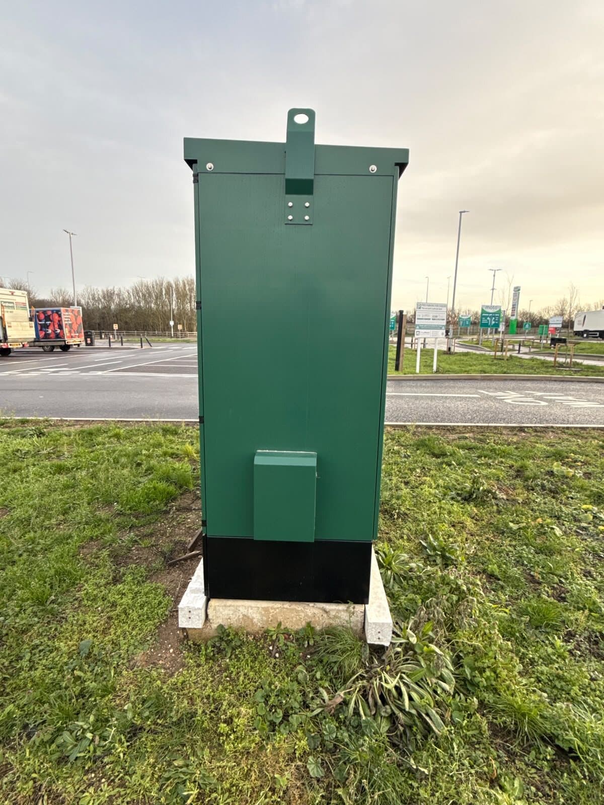 Slimline feeder pillar set on its base beside the carriageway