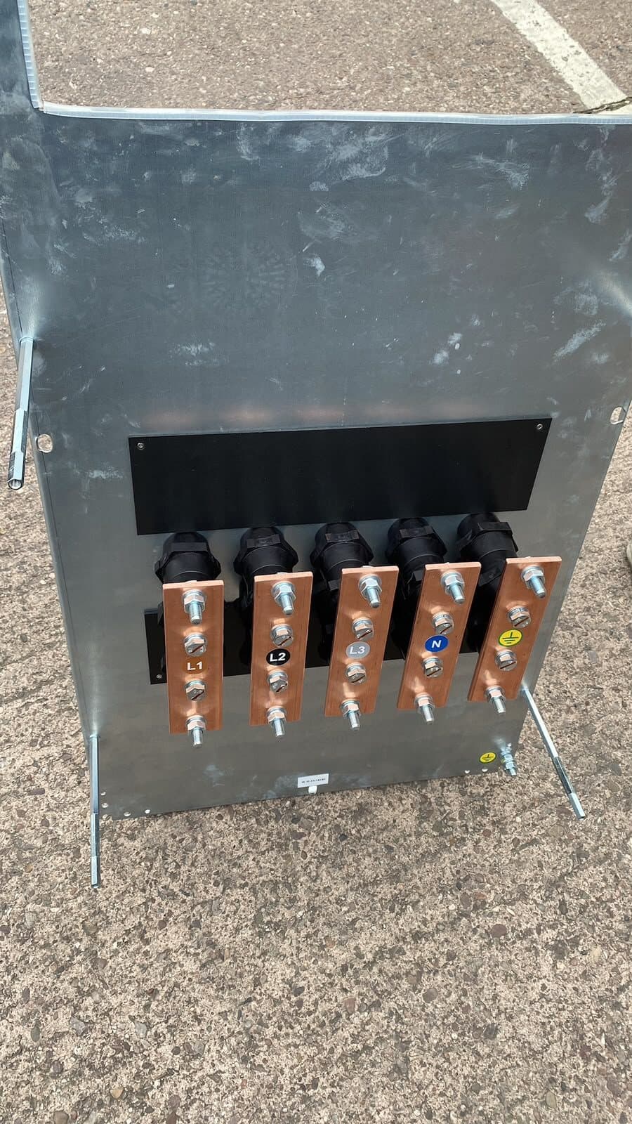 Gland plate made up off site, with the cables glanded and terminated onto copper links