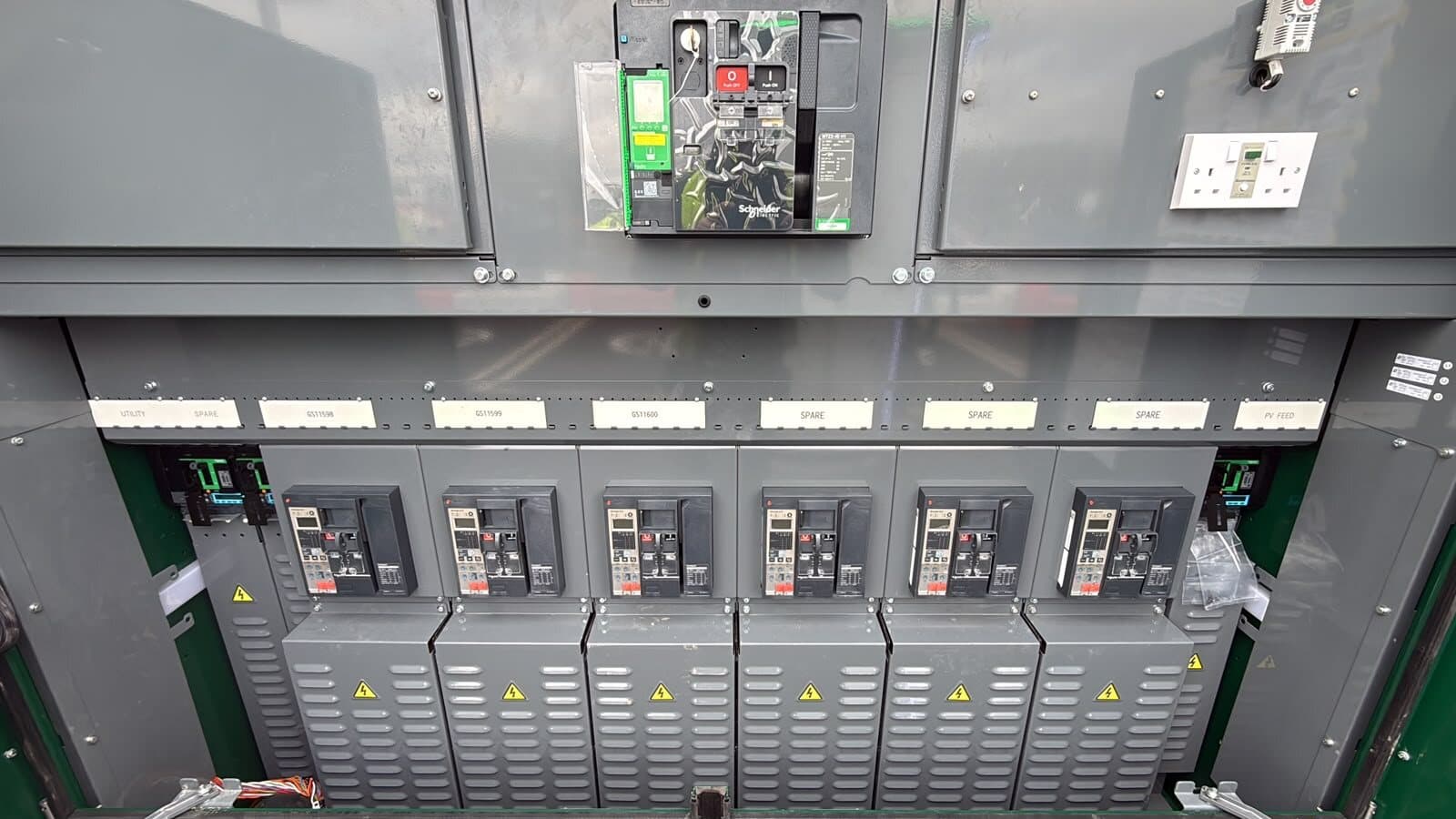 Low-voltage panel with a full row of breakers and the outgoing circuits labelled