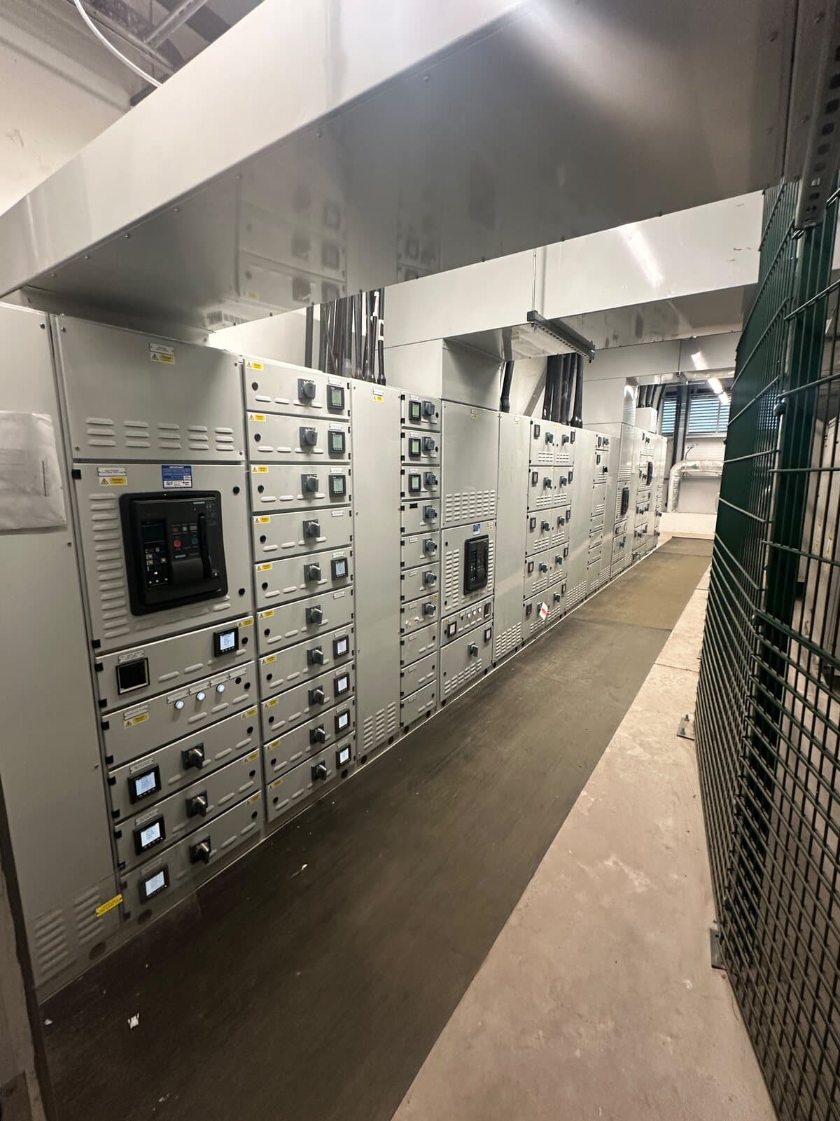 Low-voltage switch room with a full line-up of metered panels and circuit breakers