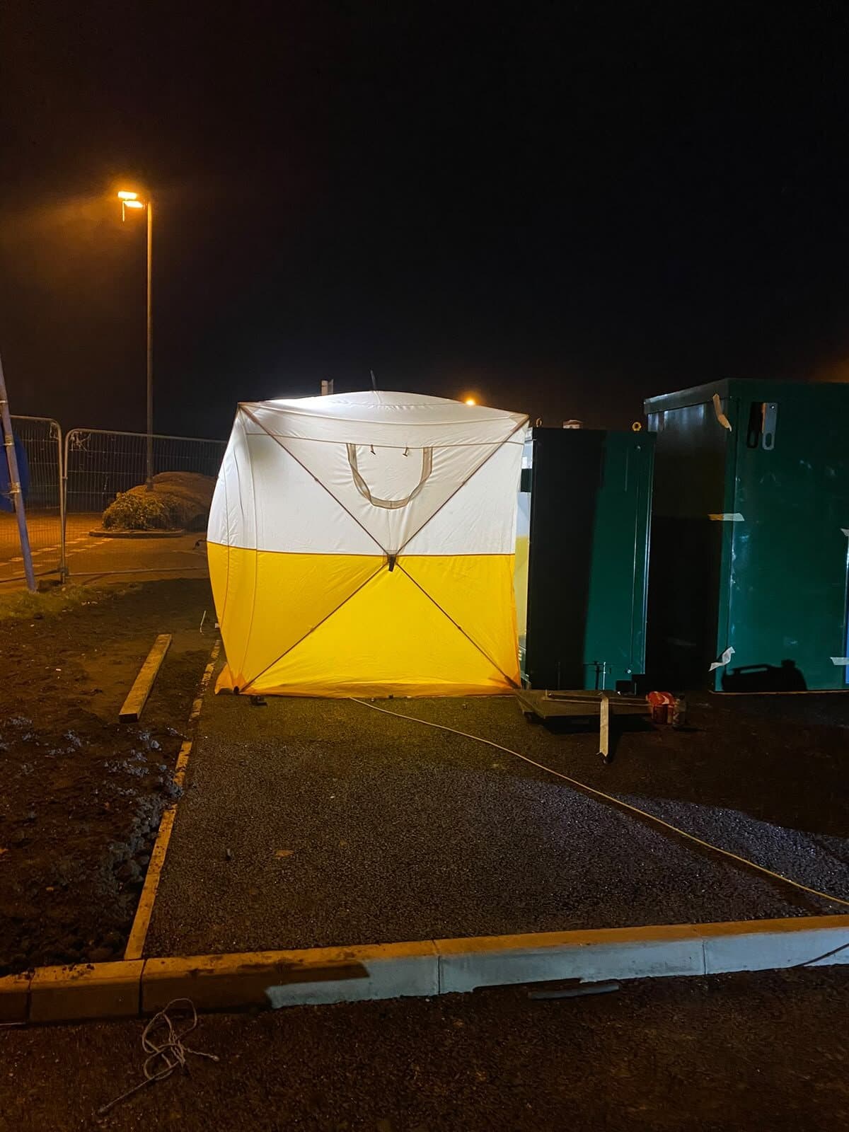 Night working on site, with a jointing shelter set up alongside the substation